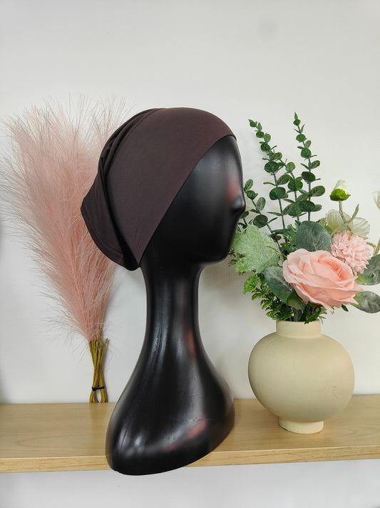 Bamboo Jersey Hijab Bond in Dark Mocha, exclusively sold by Hikmah Boutique. This hijab bond offers the perfect blend of comfort and style, making it an essential hijab cap addition for any hijabi.