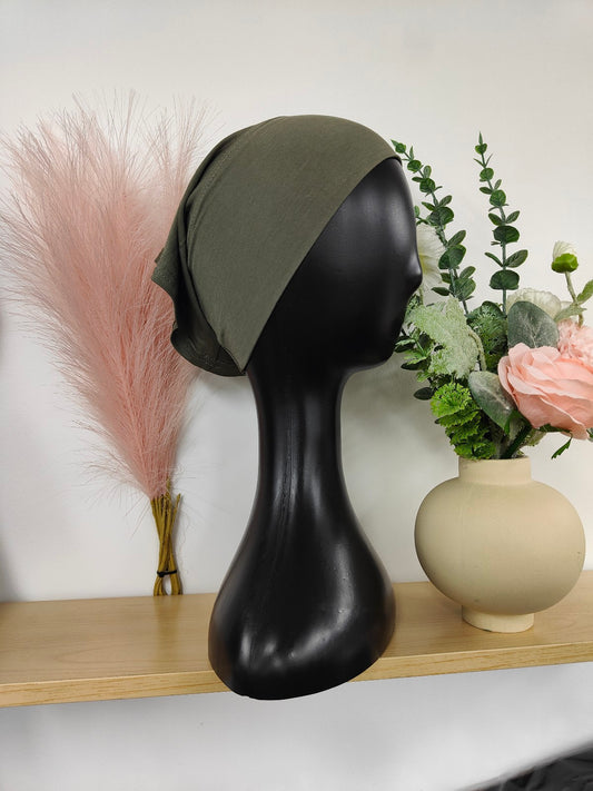 Bamboo Jersey Hijab Bond in Olive Green, exclusively sold by Hikmah Boutique. This hijab bond combines comfort and style, making it a versatile and elegant hijab cap addition to modest clothing.
