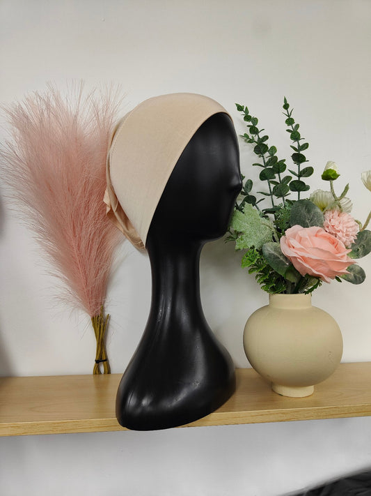 Bamboo Jersey Hijab Bond in Peach, exclusively sold by Hikmah Boutique. This hijab bond is designed for both comfort and style, making it a must-have hijab cap addition for any modest clothing.
