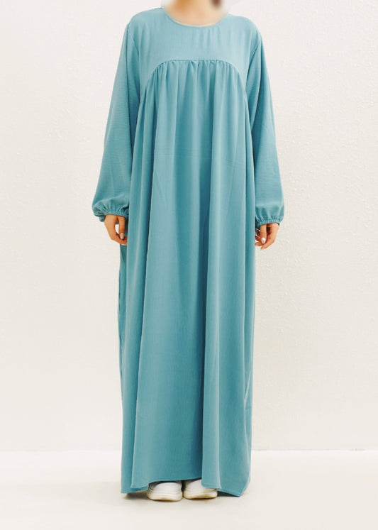 Introducing the Epitome of Modest Clothing: Aqua Crepe Abaya by Hikmah Boutique Elevate your modest wardrobe with the timeless elegance of our Aqua Crepe Abaya, exclusively crafted for the modern Muslim woman who seeks both style and modesty. At Hikmah Boutique, we understand the significance of modest clothing in Islam.