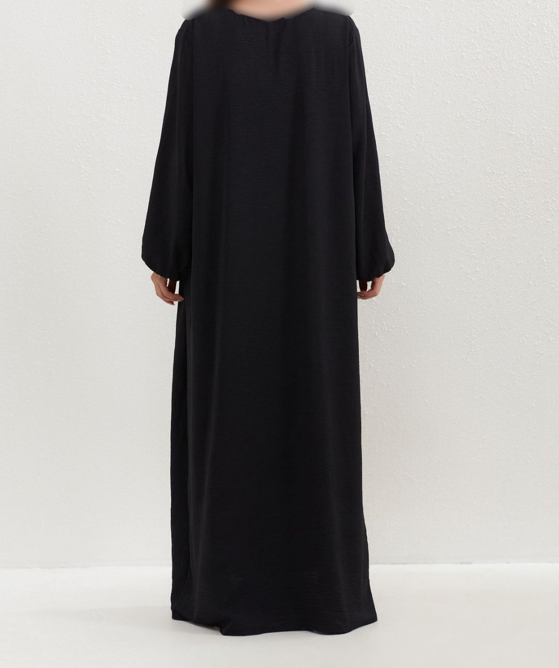 Introducing the Epitome of Modesty: Black Crepe Abaya from Hikmah Boutique Elegance, sophistication, and modesty converge in our exclusive Black Crepe Abaya, meticulously crafted to meet the discerning needs of Muslim women seeking impeccable modest clothing. 