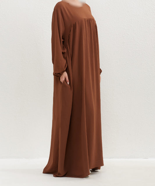 Introducing the Epitome of Modest Fashion: Mocha Crepe Abaya by Hikmah Boutique Elevate your modest wardrobe with our exclusive Mocha Crepe Abaya, meticulously designed to meet the requirements of modest clothing in Islam. At Hikmah Boutique, we understand the importance of embracing Islamic Clothing requirements.