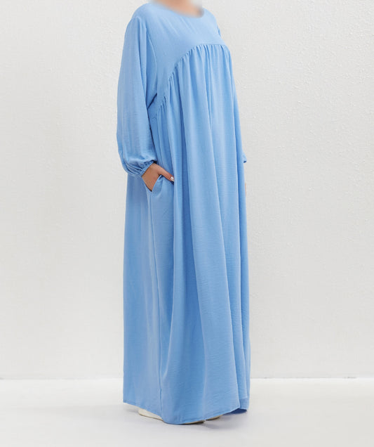 Introducing the Epitome of Modest Elegance: Sky Blue Crepe Abaya by Hikmah Boutique Elevate your modest wardrobe with our exclusive Sky Blue Crepe Abaya, meticulously crafted to embody sophistication, grace, and timeless elegance. At Hikmah Boutique, we understand the significance of modest clothing in Islam.