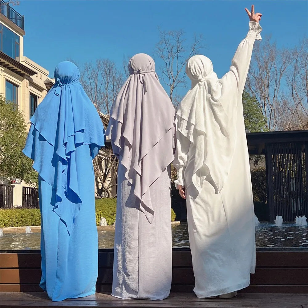 Dive into the serene allure of our Sky Blue Crepe Crinkle Abaya with Double Layer Khimar Set, a celestial creation found exclusively at Hikmah Boutique. Immerse yourself in the tranquility of the sky with this ensemble that seamlessly merges traditional modesty with contemporary elegance.