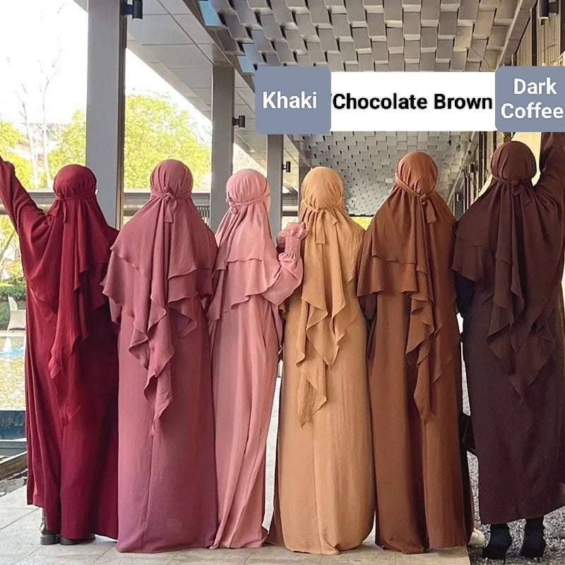 Shop Modest Clothing with our Dark Coffee Crepe Crinkle Abaya with Double Layer Khimar Set – Exclusive Modesty at Hikmah Boutique Indulge in the timeless elegance of our Dark Coffee Crepe Crinkle Abaya with Double Layer Khimar Set, a symbol of modesty and sophistication exclusively available at Hikmah Boutique.
