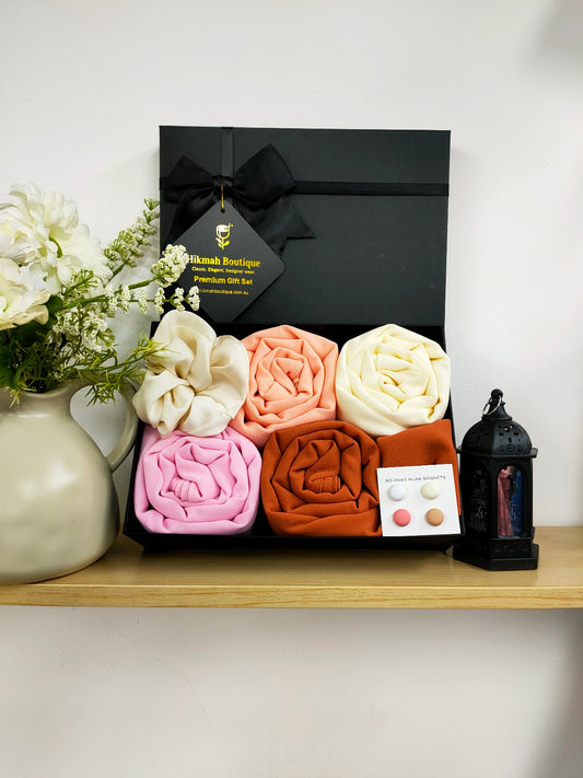 Introducing the Hijab Gift Box - The Blossom Set by Hikmah Boutique, the perfect gift for any Hijabi looking for a touch of luxury hijabs in her wardrobe. This hijab set consists of four premium chiffon hijabs in stunning colors: blossom, cream, pink, and canyon clay, large satin scrunchie and 4 pairs of hijab magnets.