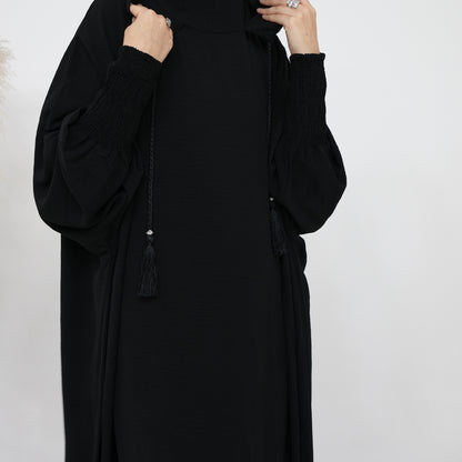 Elevate your modest wardrobe with our exclusive Hooded Jilbab Abaya in Black, meticulously designed and exclusively sold by Hikmah Boutique. Combining the elegance of a traditional Abaya with the functionality of a Hooded Jilbab.