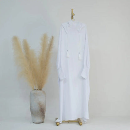 Discover purity and modesty with our White Hooded Jilbab Abaya, a symbol of grace and elegance exclusively available at Hikmah Boutique. Meticulously crafted, this refined garment is designed to elevate your modest wardrobe with timeless sophistication.