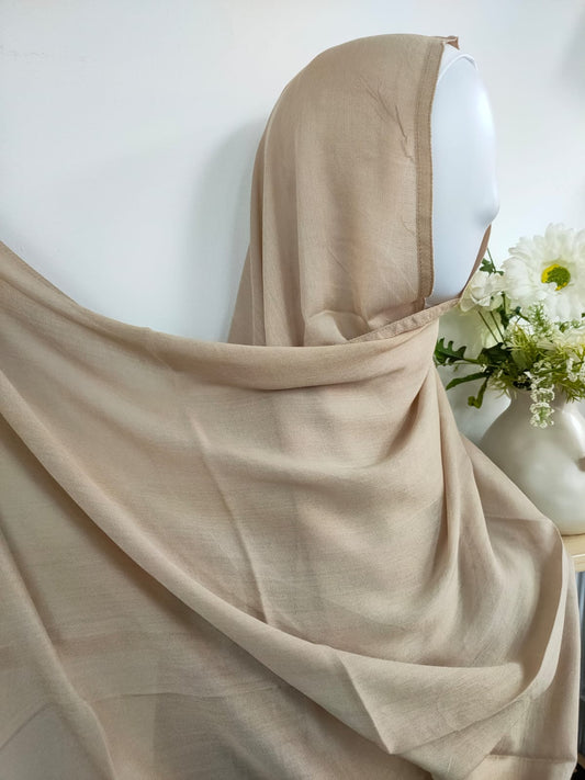 Introducing our luxurious Modal Hijab in Dark Beige, a refined addition to your hijab collection, available at Hikmah Boutique! Expertly crafted from premium modal fabric, known for its exquisite softness and breathability, this modal hijab ensures comfort and style all day. Based in Australia, Deliver Worldwide.