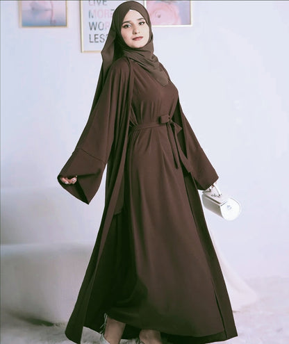Step into the epitome of modest elegance with our exclusive Plain Abaya 3-piece set in Dark Coffee, brought to you by Hikmah Boutique. Crafted with meticulous attention to detail, each piece in this ensemble is tailored from premium crepe fabric, ensuring a luxurious feel and a graceful modest clothing silhouette.