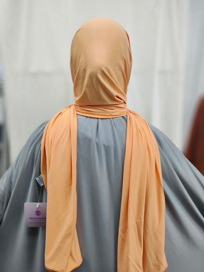Discover the pinnacle of elegance and comfort with our Tangerine Pure Bamboo Hijab, exclusively offered by Hikmah Boutique. This hijab seamlessly merges style, breathability, and eco-friendliness, making it the ideal choice for any occasion. Stay cool and confident with Hikmah Boutique's Premium Quality Hijabs.