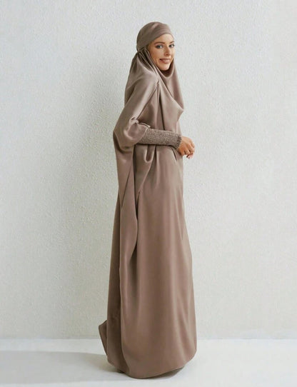 Introducing a timeless expression of modest sophistication - the Satin Jilbab in Mocha, exclusively presented by Hikmah Boutique. Envelop yourself in the gentle embrace of satin fabric, thoughtfully crafted to embody grace and elegance in its purest form.