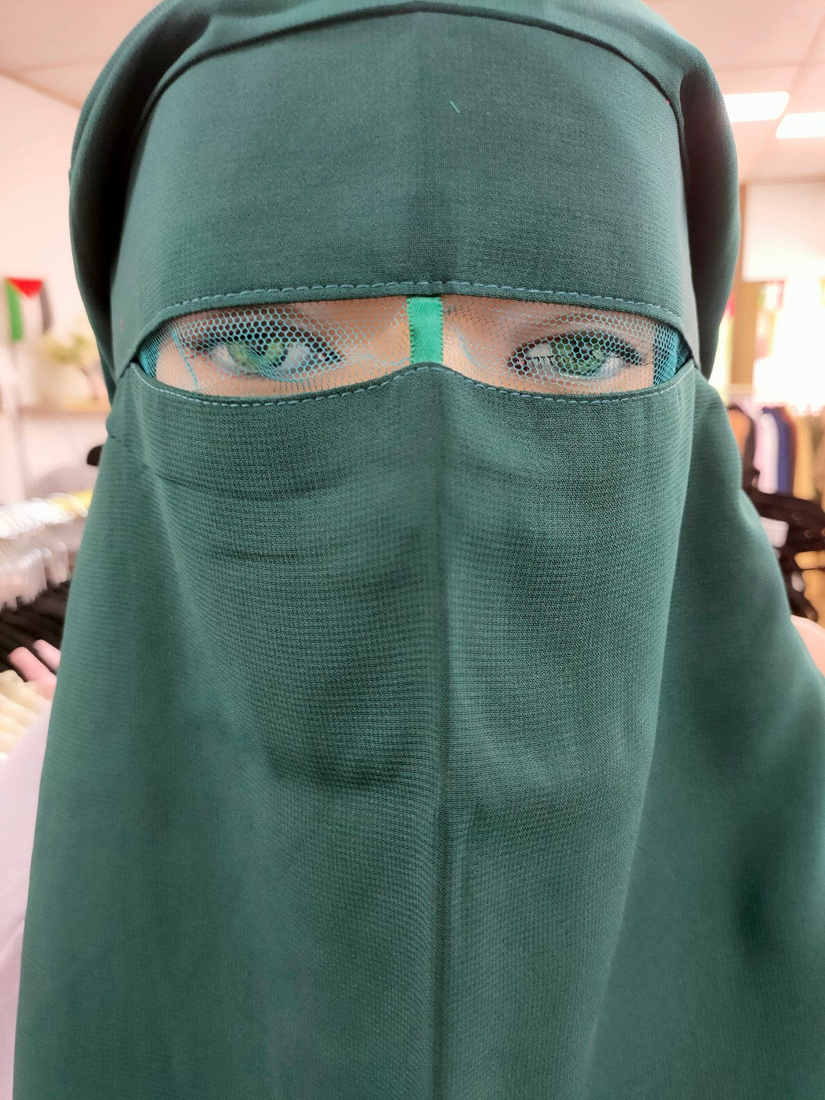 Introducing the Hikmah Boutique Triple Layer Niqab in Dark Green: Embrace Modesty with Timeless Elegance Step into the world of Islamic niqabs with our exclusive Triple Layer Niqab in Dark Green, meticulously crafted to cater to the discerning needs of modest clothing.