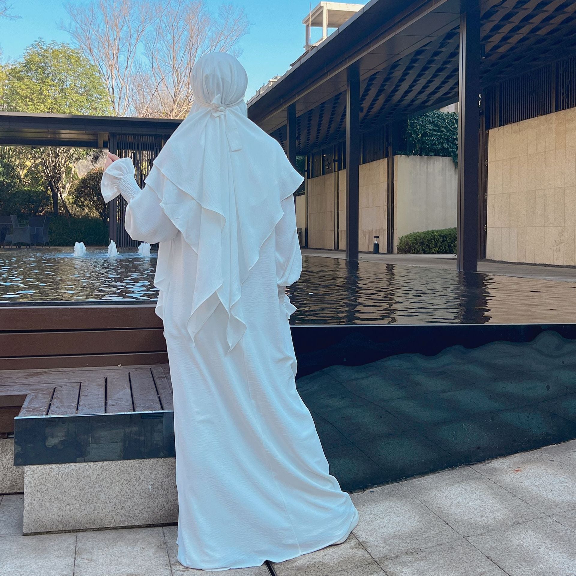 Shop Modest Clothing with our White Crepe Crinkle Abaya with Double Layer Khimar Set, a Timeless Modesty at Hikmah Boutique. Embrace the purity of style with our White Crepe Crinkle Abaya with Double Layer Khimar Set, an embodiment of timeless modesty and sophistication exclusively available at Hikmah Boutique.