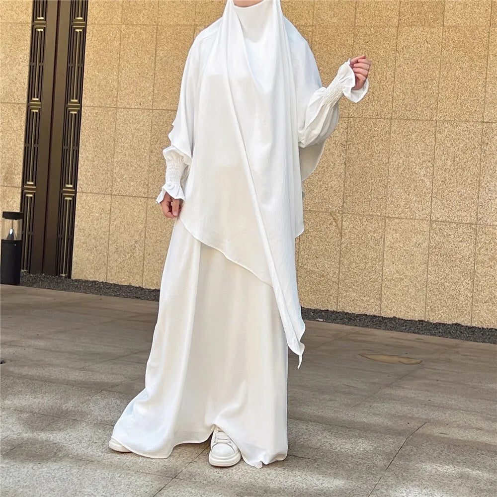 Shop Modest Clothing with our White Crepe Crinkle Abaya with Double Layer Khimar Set, a Timeless Modesty at Hikmah Boutique. Embrace the purity of style with our White Crepe Crinkle Abaya with Double Layer Khimar Set, an embodiment of timeless modesty and sophistication exclusively available at Hikmah Boutique.