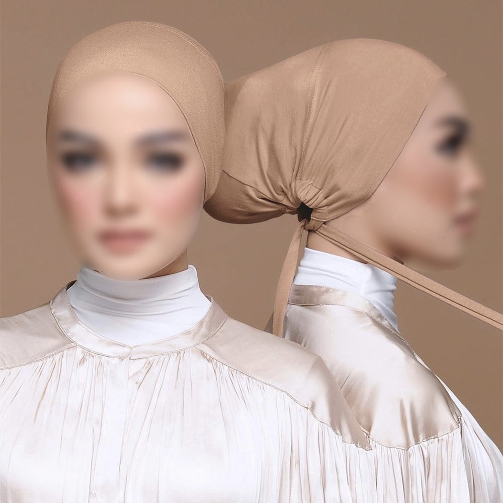 Discover Tan Peach Bamboo Closed Hijab Cap at Hikmah Boutique. Moisture-wicking, soft bamboo with an adjustable tie-back. Pairs well with Matching Undercaps. Shop now!