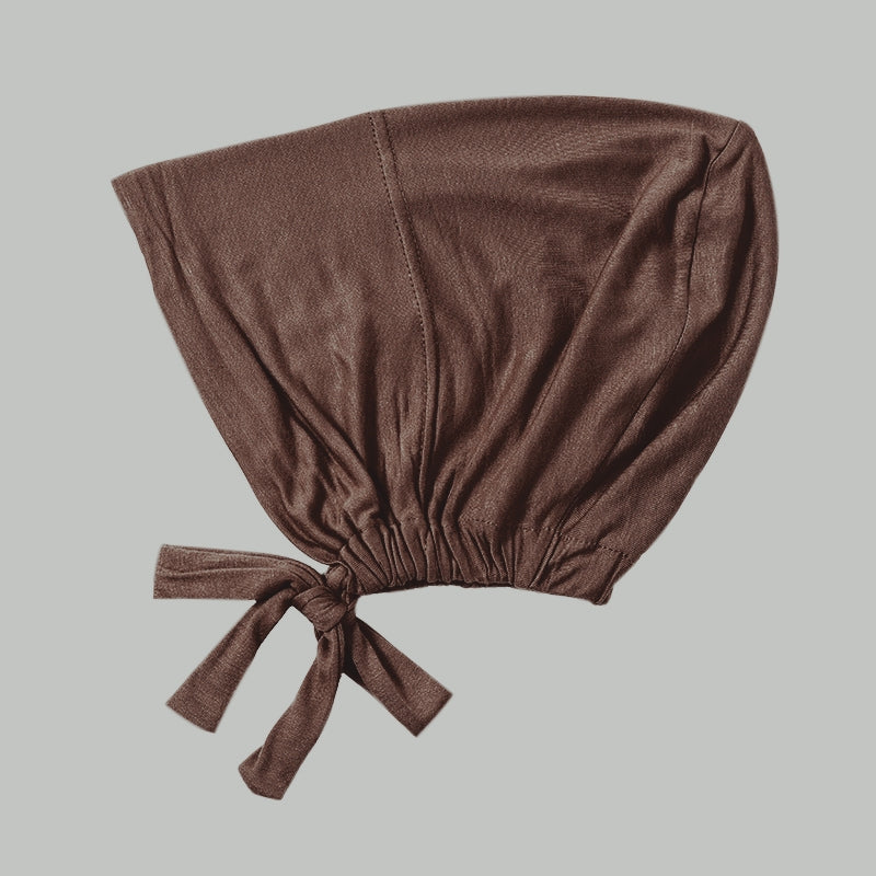 Shop Coffee Bamboo Closed Hijab Cap at Hikmah Boutique. Soft, moisture-wicking bamboo material with tie-back adjustability for this undercap. Buy online or in-store now.