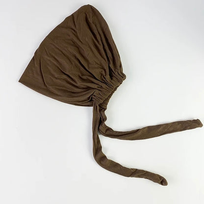 Shop Coffee Bamboo Closed Hijab Cap at Hikmah Boutique. Soft, moisture-wicking bamboo material with tie-back adjustability for this undercap. Buy online or in-store now.