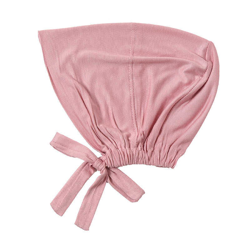 Discover Dusty Pink Bamboo Closed Hijab Cap at Hikmah Boutique. Soft, eco-friendly bamboo fabric with tie-back adjustment. Perfect Hijab underscarf. Shop now online or in-store Australia.