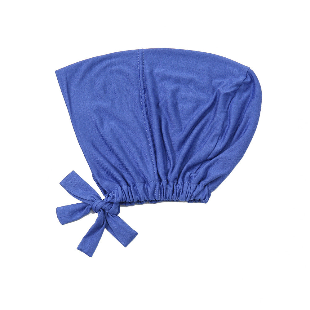 Discover Dusty Royal Blue Bamboo Closed Hijab Cap at Hikmah Boutique. Eco-friendly, soft, and moisture-wicking bamboo. Shop underscarf now for comfort and style.