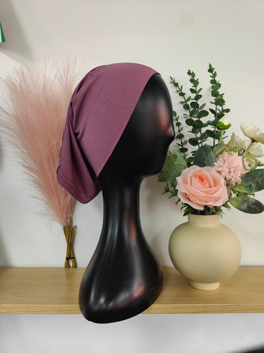Bamboo Jersey Hijab Bond in Dusty Purple, exclusively sold by Hikmah Boutique. This hijab bond combines comfort and style, making it an essential hijab cap addition for any hijabi modest clothing.