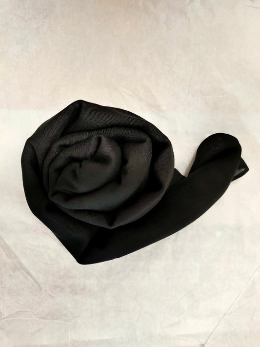 Discover the epitome of elegance with our premium Black Chiffon Hijab at Hikmah Boutique. Crafted with a 50% higher thread count for enhanced durability and draped to perfection, our hijabs offer timeless sophistication. Shop now!