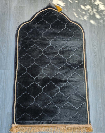 Experience comfort and spirituality with our premium Black Padded Prayer Mat. Crafted with velvet fabric, this luxurious mat offers superior comfort for your prayers. Explore our wide selection of Islamic prayer mats, prayer rugs. Exceptional comfort and support in your salah or prayer. Shop now at Hikmah Boutique.