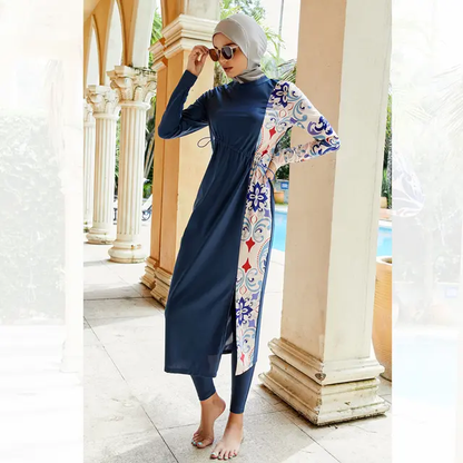 Get ready for beach vibes with our Blue Modest Burkini 3Pcs Set, only at Hikmah Boutique. Enjoy the full coverage, style, and cultural expression with a long top, hijab ninja cap, and pants. It's affordable luxury, available in all sizes. Redefine your beach look effortlessly!