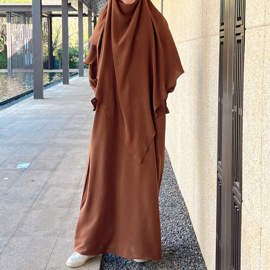 Shop Modest Clothing with our Chocolate Brown Crepe Crinkle Abaya with Double Layer Khimar Set – Exclusive Modesty at Hikmah Boutique Indulge in the understated allure of our Chocolate Brown Crepe Crinkle Abaya with Double Layer Khimar Set, a symbol of timeless modesty available at Hikmah Boutique.