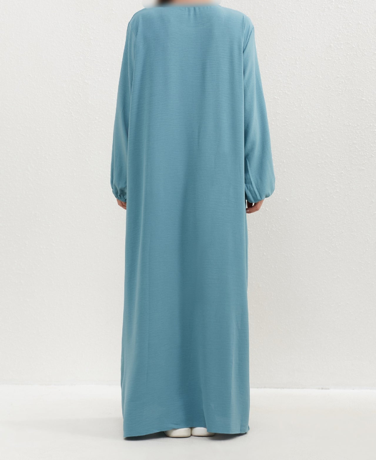 Introducing the Epitome of Modest Clothing: Aqua Crepe Abaya by Hikmah Boutique Elevate your modest wardrobe with the timeless elegance of our Aqua Crepe Abaya, exclusively crafted for the modern Muslim woman who seeks both style and modesty. At Hikmah Boutique, we understand the significance of modest clothing in Islam.