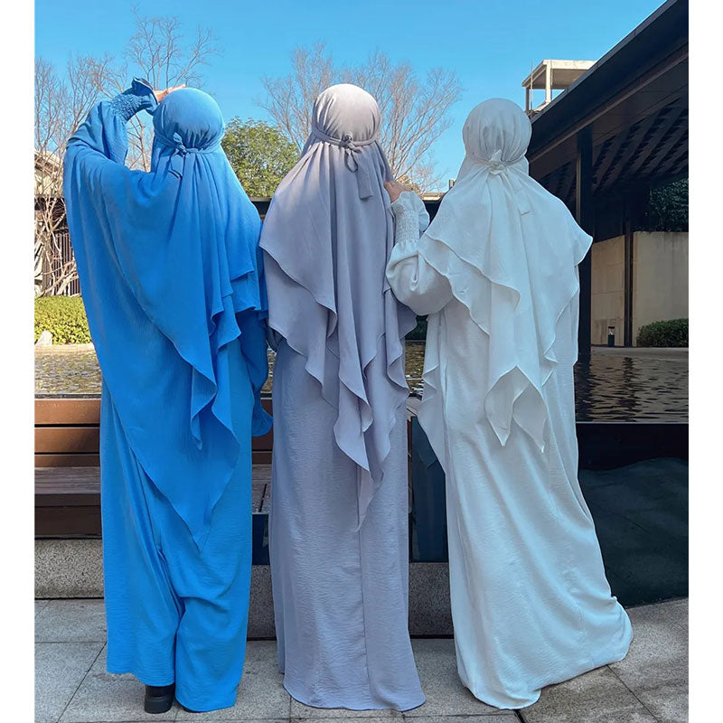 Dive into the serene allure of our Sky Blue Crepe Crinkle Abaya with Double Layer Khimar Set, a celestial creation found exclusively at Hikmah Boutique. Immerse yourself in the tranquility of the sky with this ensemble that seamlessly merges traditional modesty with contemporary elegance.