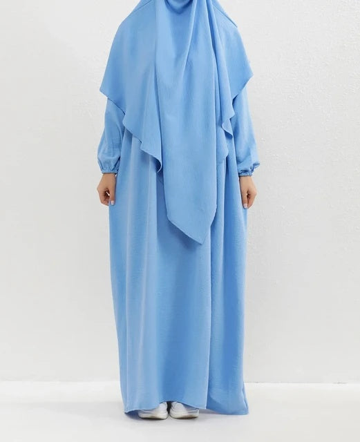 Introducing our graceful Crepe Double Layer Khimar in Sky Blue, available exclusively at Hikmah Boutique. Crafted with meticulous attention to detail, this khimar is designed to enhance your modest attire with a touch of serene elegance.