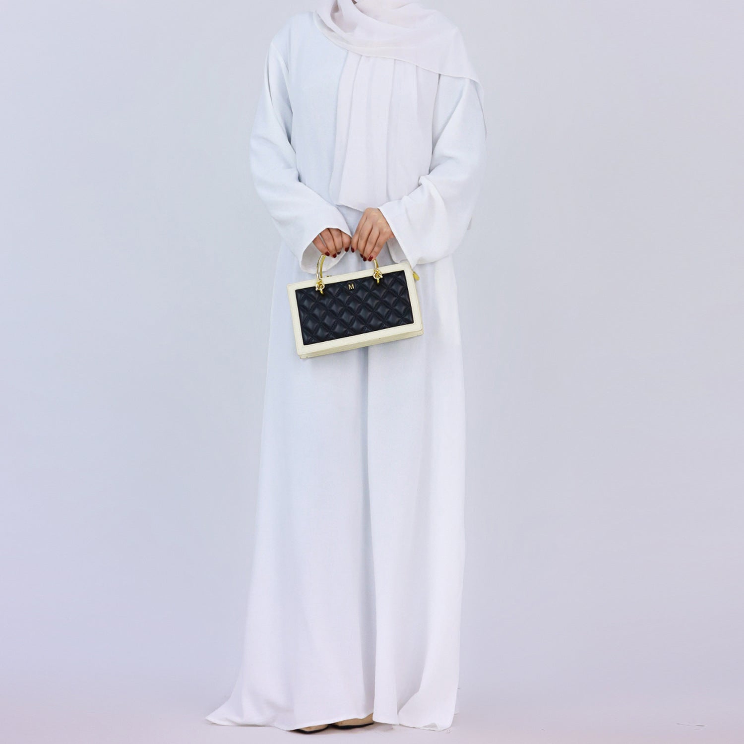 Discover pure elegance with our White Crepe Abaya. This plain, modest abaya is perfect for everyday wear or special occasions. Crafted from luxurious crepe, it offers comfort and style. Find your perfect white abaya online now.