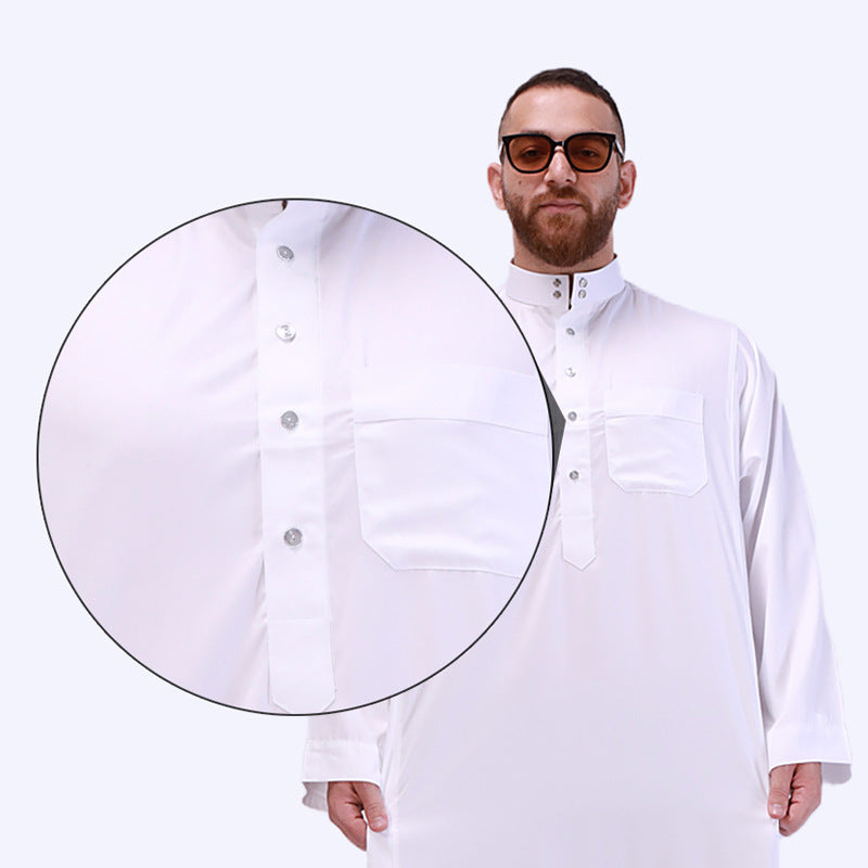 Daffah Men's Thobe in White, exclusive by Hikmah Boutique. Crafted with precision and attention to detail, this exquisite Thobe seamlessly blends Islamic Clothing tradition with modest clothing style, making it a must-have attire for every discerning gentleman who appreciate Muslim Clothing. 
