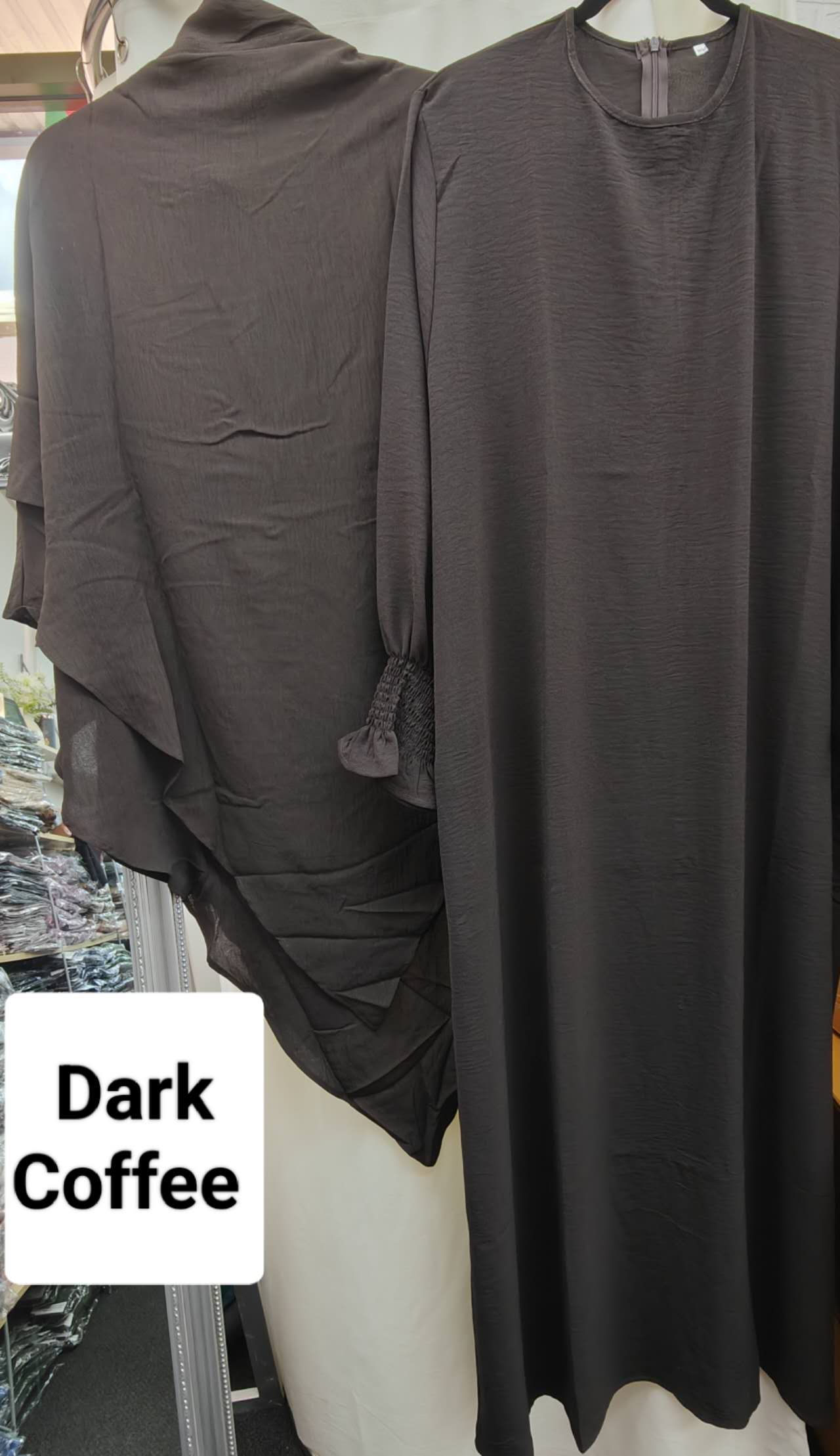 Shop Modest Clothing with our Dark Coffee Crepe Crinkle Abaya with Double Layer Khimar Set – Exclusive Modesty at Hikmah Boutique Indulge in the timeless elegance of our Dark Coffee Crepe Crinkle Abaya with Double Layer Khimar Set, a symbol of modesty and sophistication exclusively available at Hikmah Boutique.