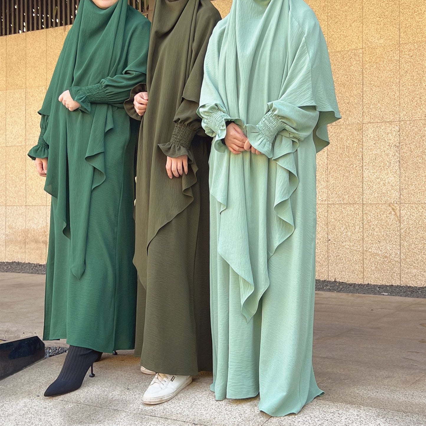 Shop Modest Clothing with our Dusty Green Crepe Crinkle Abaya with Double Layer Khimar Set – Exclusive Modesty at Hikmah Boutique. Immerse yourself in the serene charm of our Dusty Green Crepe Crinkle Abaya with Double Layer Khimar Set, a timeless modesty exclusively available at Hikmah Boutique.