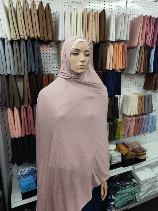 Discover our premium Jersey Hijab in Dusty Pink at Hikmah Boutique. Soft, stretchable, and lightweight, perfect for summer and sports. Shop stylish, affordable hijabs online from the best hijab shop and modest clothing store.