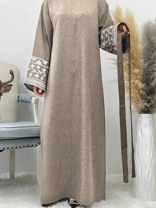 Discover the elegance of our Islamic brown opal abaya with embroidered sleeves. This exquisite piece is perfect for any modest occasion. Shop now at Hikmah Boutique Sydney.