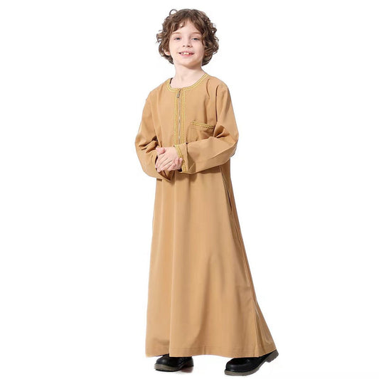 Our caramel embroidered boys' thobe offers a warm and inviting look. This versatile Islamic Thobe color is perfect for both formal and casual occasions, making your child look effortlessly stylish yes modest.