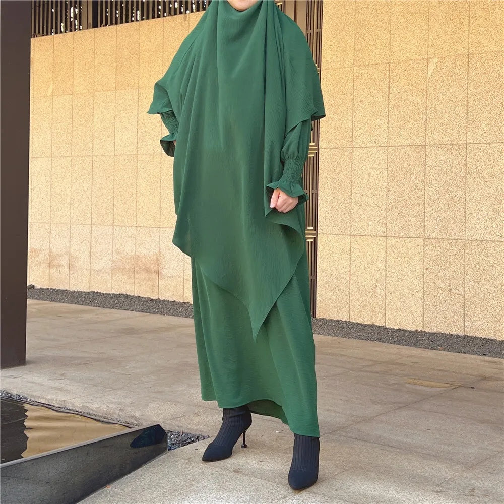 Shop Modest Clothing with our Emerald Green Crepe Crinkle Abaya with Double Layer Khimar Set – Exclusive Modesty at Hikmah Boutique Description: Indulge in the captivating allure of our Emerald Green Crepe Crinkle Abaya with Double Layer Khimar Set, a timeless modesty exclusively available at Hikmah Boutique.