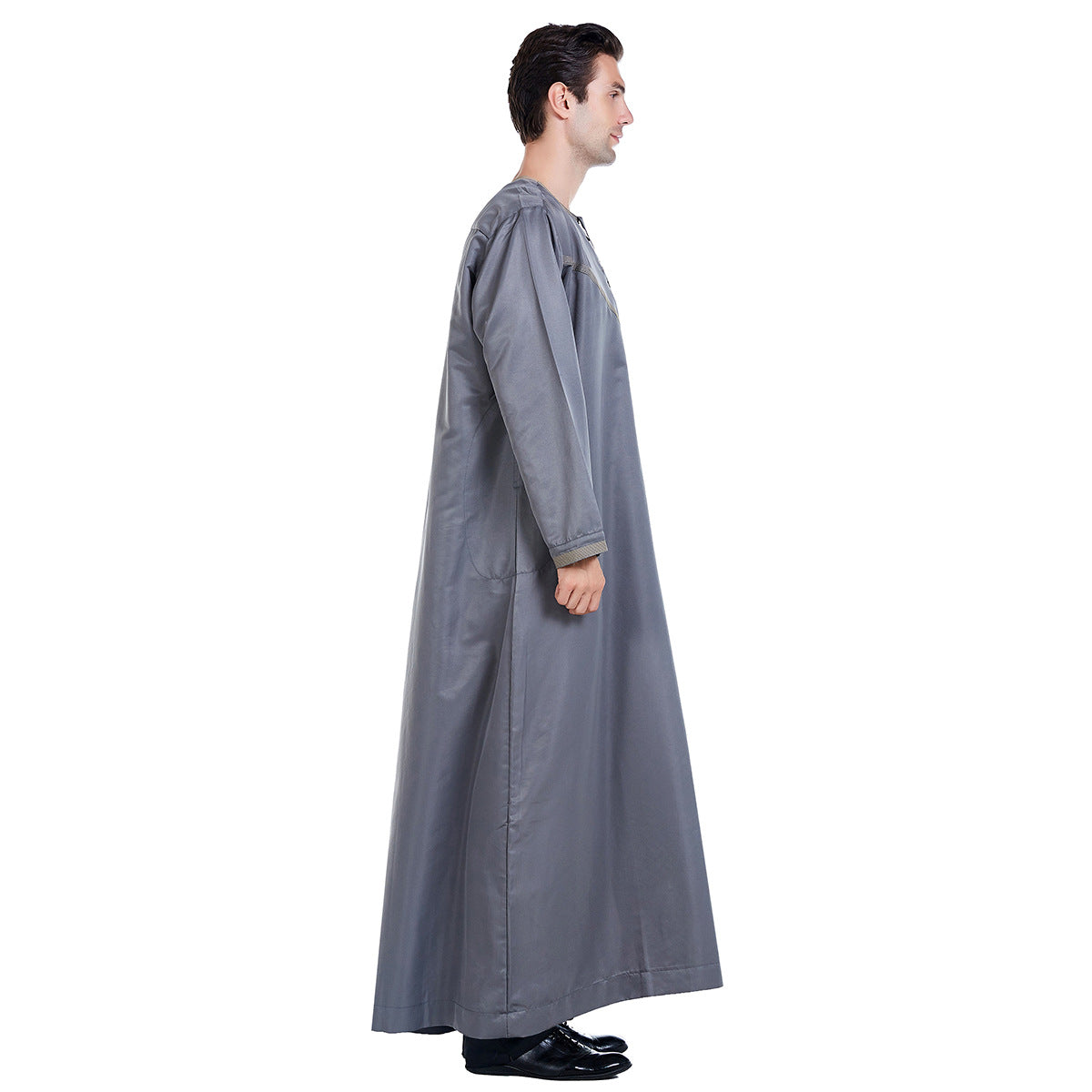 Introducing the Emirati Men's Thobe in Grey, a captivating and versatile garment that effortlessly combines traditional Islamic elegance with Modest Clothing style. This meticulously crafted thobe is designed to enhance your appearance and offer unrivaled comfort, making it a perfect choice for any occasion.