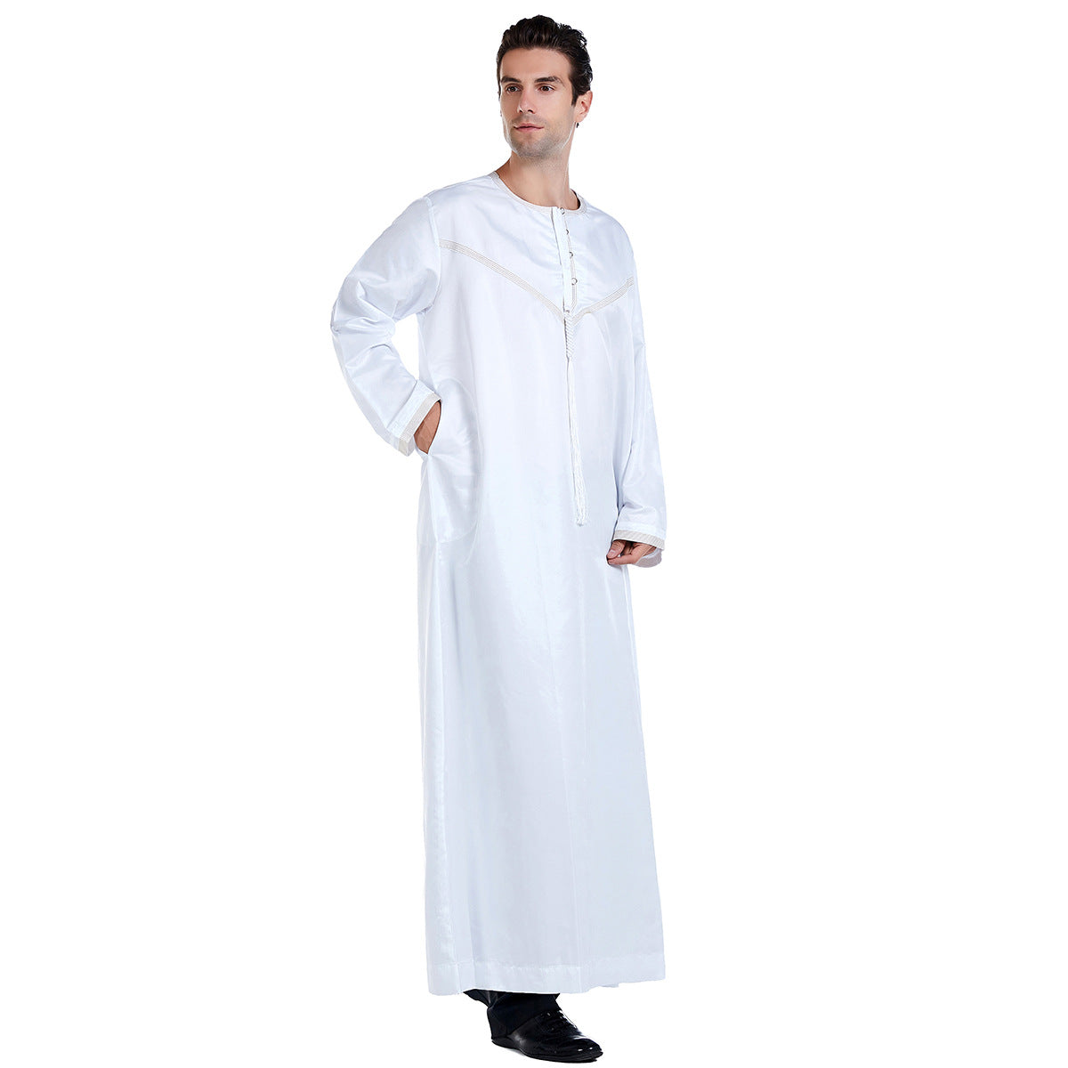 Exclusive Emirati Men's Thobe in White by Hikmah Boutique, a Modest Clothing garment that effortlessly combines traditional Islamic elegance with contemporary Modest style  making it a perfect choice for any occasion like Eid, Ramadan or Muslim Islamic Wedding.