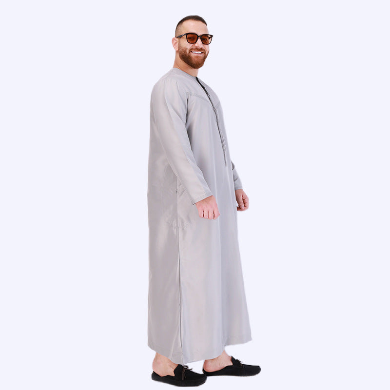 Elevate your style with our Emirati Men's Thobe in Light Olive. Explore a blend of tradition and modern design thobes for men at Hikmah Boutique. Shop this Islamic thobe now!
