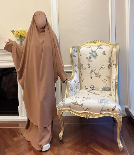 Introducing the Grey French Jilbab by Hikmah Boutique, the perfect addition to your modest wardrobe. Made with high-quality materials, this jilbab is designed for comfort and durability, ensuring it will last you for years to come. The grey color is elegant and versatile, making it the perfect choice for any occasion.