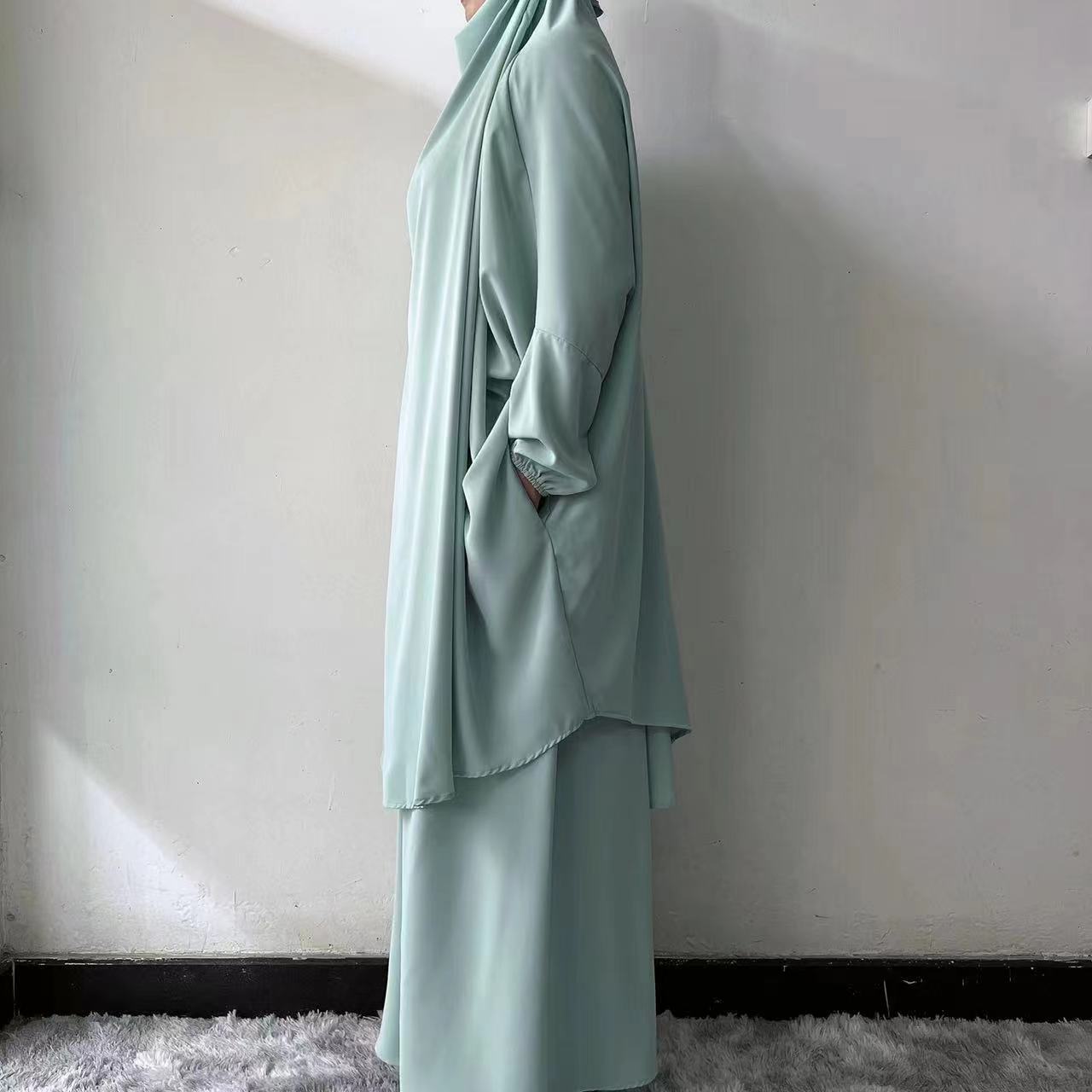 Discover the beauty of modest fashion with our Dusty Green French Jilbab Prayer Set, exclusively at Hikmah Boutique. This one-size jilbab and skirt set, featuring cuff sleeves, is crafted from high-quality Nida for maximum comfort and breathability.