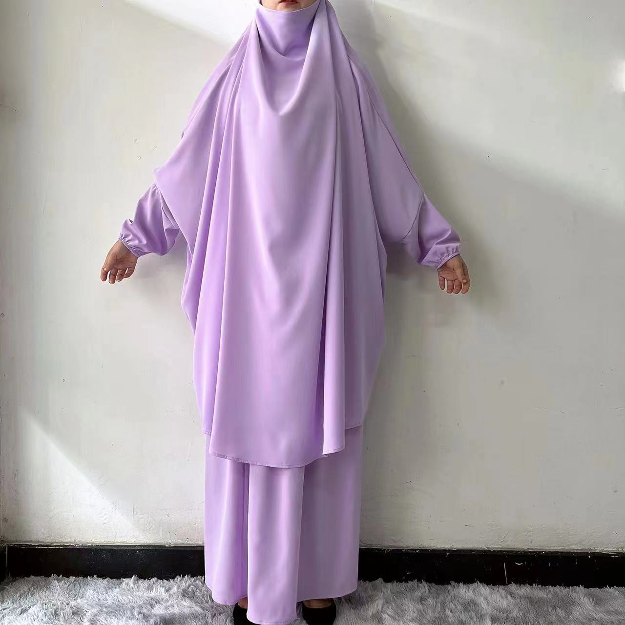 Embrace regal elegance with our Dusty Purple French Jilbab Prayer Set, available exclusively at Hikmah Boutique. This one-size jilbab and skirt set, featuring cuff sleeves, is crafted from premium Nida fabric for unmatched comfort and breathability.