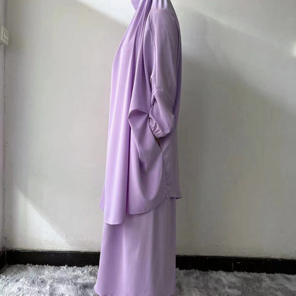 Embrace regal elegance with our Dusty Purple French Jilbab Prayer Set, available exclusively at Hikmah Boutique. This one-size jilbab and skirt set, featuring cuff sleeves, is crafted from premium Nida fabric for unmatched comfort and breathability.