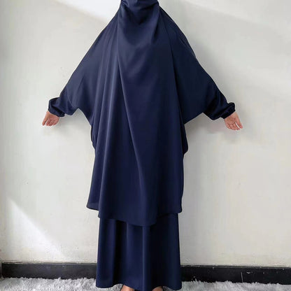 Discover the classic elegance of our Navy French Jilbab Prayer Set, available exclusively at Hikmah Boutique. This one-size jilbab and skirt set with cuff sleeves is made from luxurious Nida fabric, offering breathability and comfort.