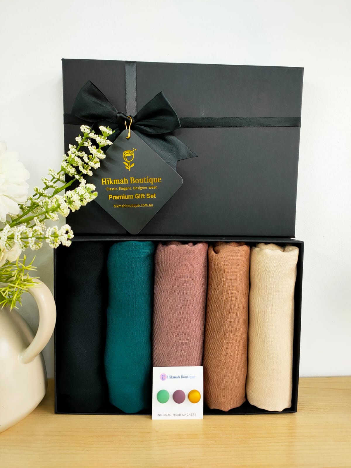 Discover elegance and sophistication with Hikmah Boutique's Modest Hazel Range Exclusive hijab gift box. Featuring premium viscose hijabs in five enchanting shades, our collection offers comfort, style, and convenience. Perfect for Eid, Ramadan, or thoughtful gifting, shop now!