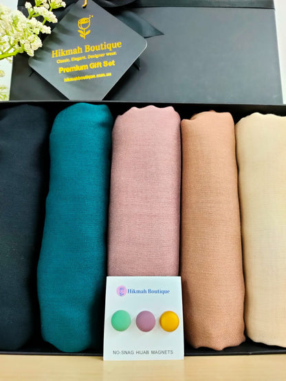 Discover elegance and sophistication with Hikmah Boutique's Modest Hazel Range Exclusive hijab gift box. Featuring premium viscose hijabs in five enchanting shades, our collection offers comfort, style, and convenience. Perfect for Eid, Ramadan, or thoughtful gifting, shop now!